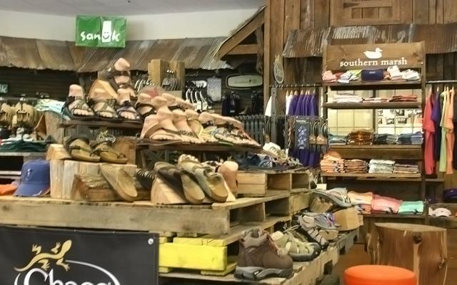 Interior photo of sporting goods on displays in River Outfitters